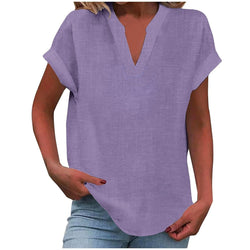 Purple V-neck rolled short sleeve top worn by woman with jeans | Myra Lina